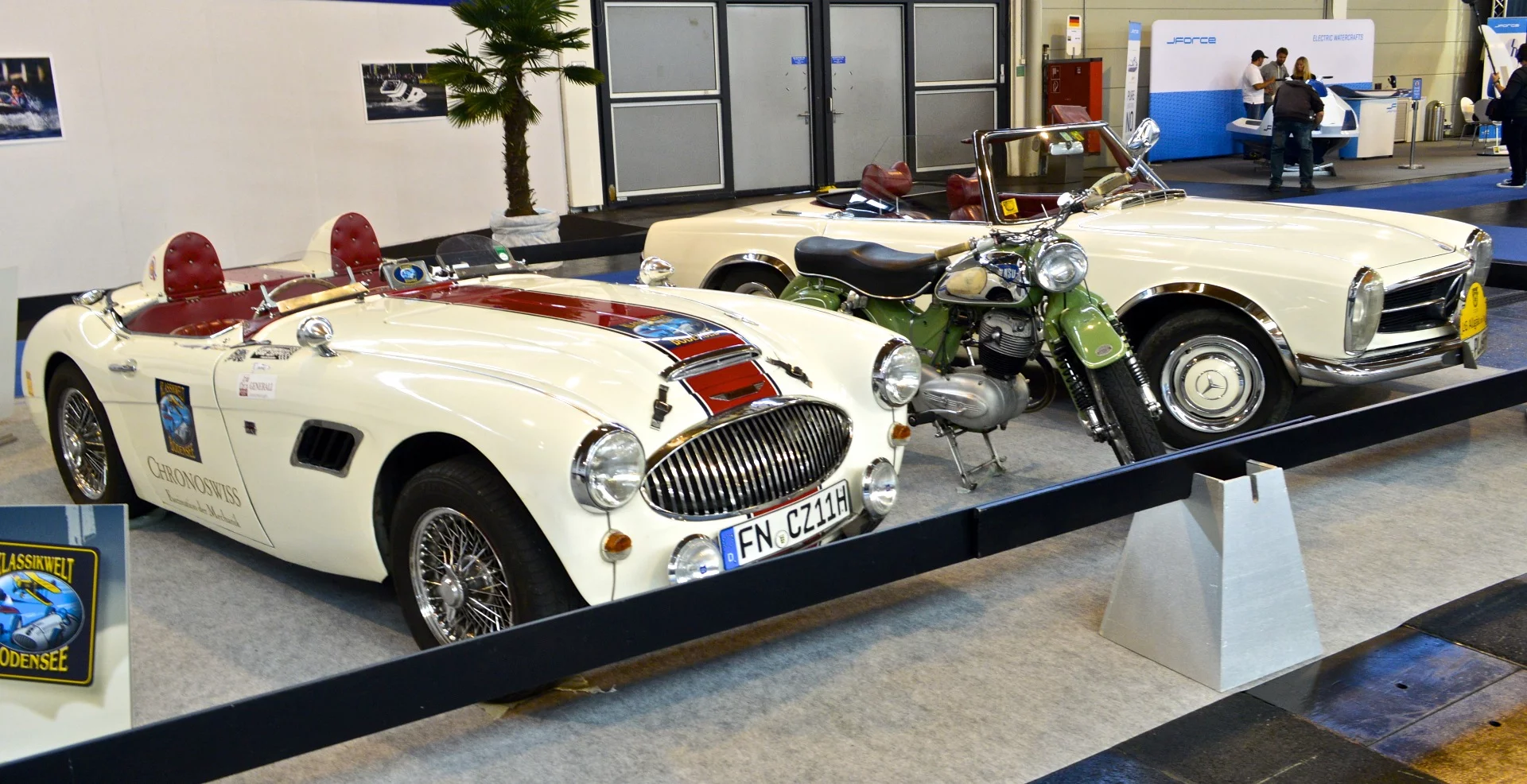 The Klassikwelt Bodensee show advertises with some classic road vehicles at the boat show