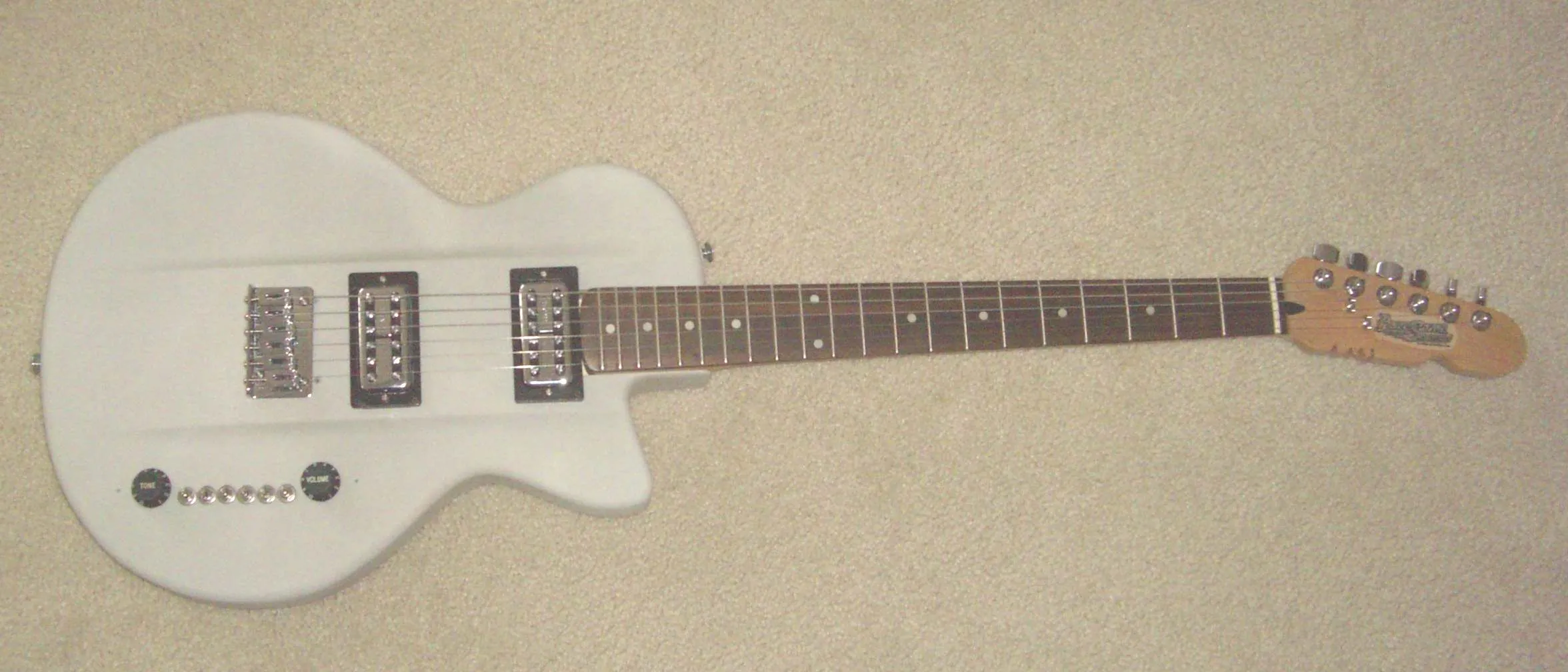 The AWE-3DG features a 25.5-inch scale maple neck with a 21-fret rosewood fingerboard, T.V. Jones PowerTron humbucker pickups, and something called the T4-Switch