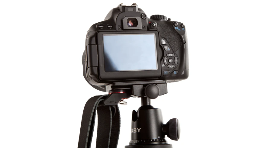 The Joby UltraPlate can be used on Arca-Swiss compatible tripods, but its main trick is that it can do so while leaving space for a shoulder strap attachment loop