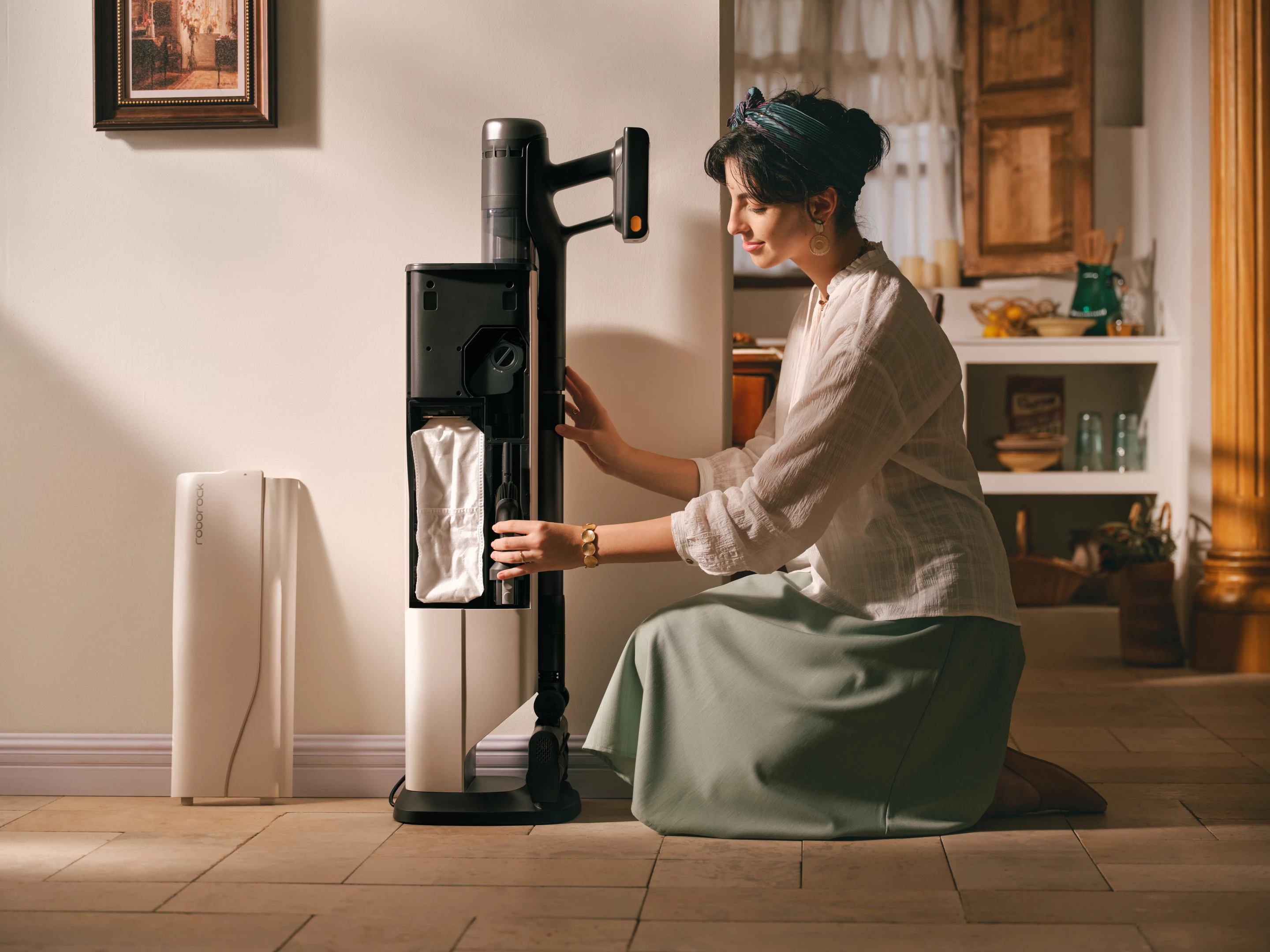 Beatific grace of this sales-model aside, the H60 Ultra's charging dock has a magnetic removable side panel, for access to the internal tool storage and the headline dust bag for the self-emptying system