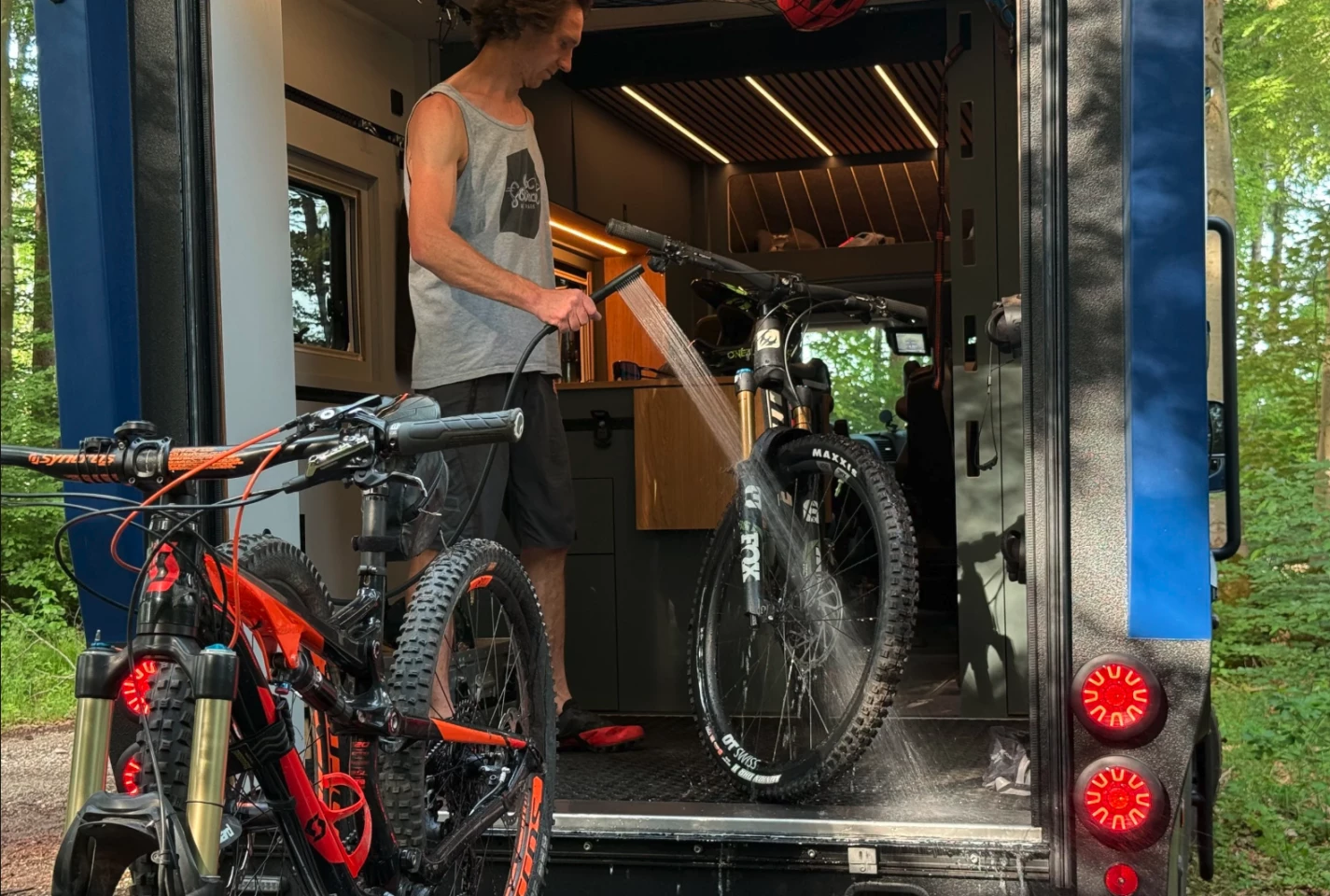 The garage doubles as a bathroom and mud room/gear wash area