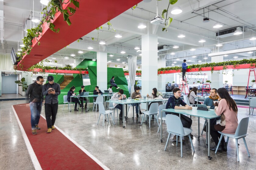 An Office for Social Well-Being: Leping Social Entrepreneur 's kitchen and dining area is ringed by the running track