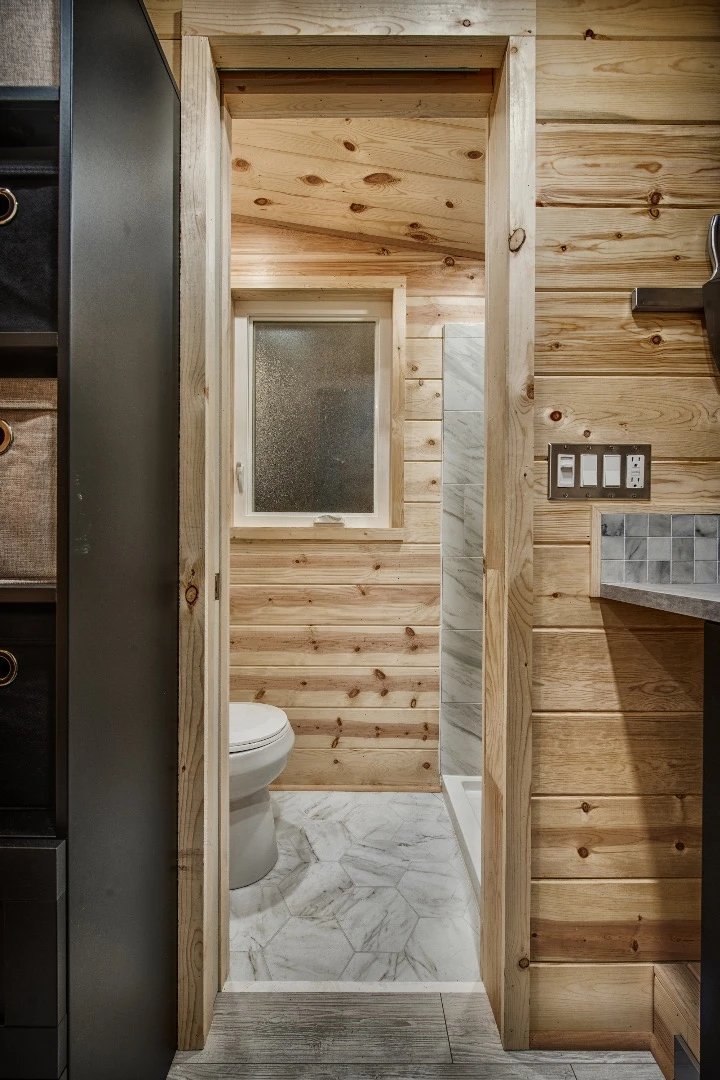 The Acorn's bathroom is reached via the kitchen