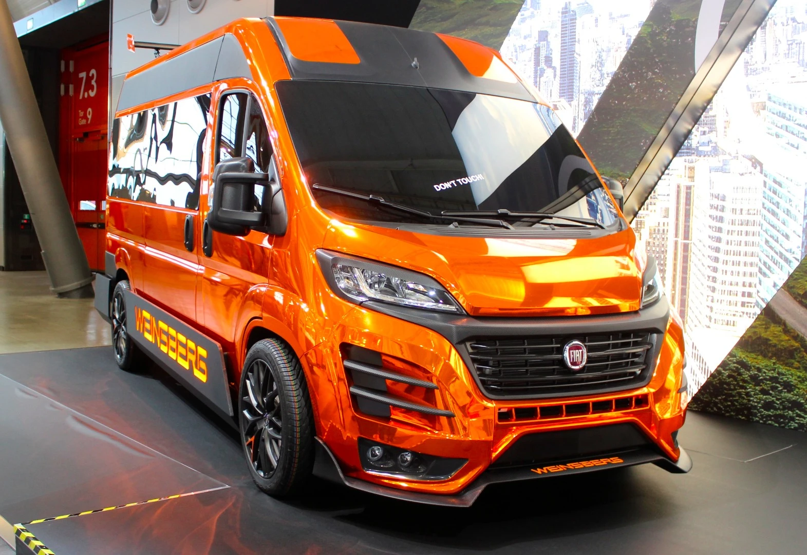 The CUVolution features all kinds of added aero work to complement its bright-orange paint