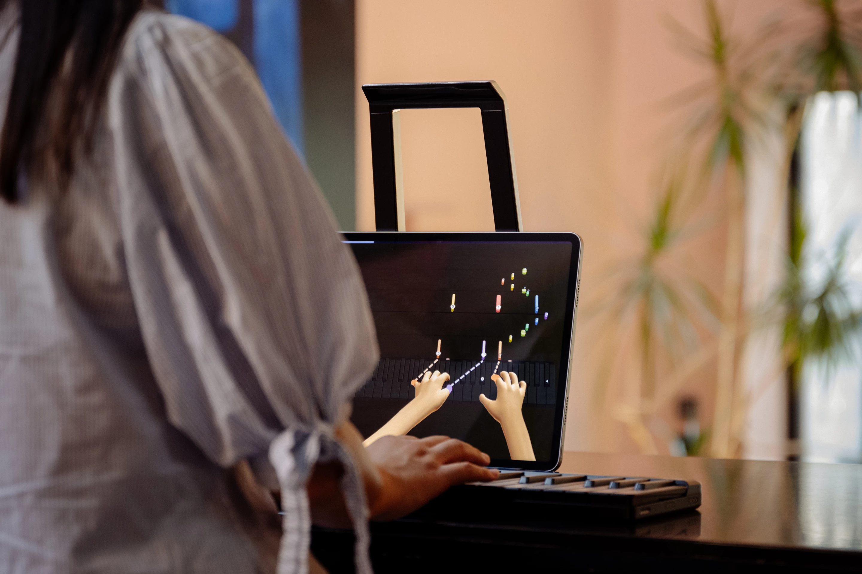 The learning app includes interactive games to teach notes, melodies and chords