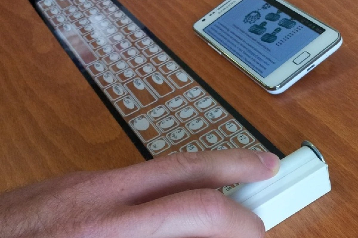 The Qii is a thin, flexible keyboard that connects wirelessly to smart devices and rolls up into a portable case about the size of a roll of coins
