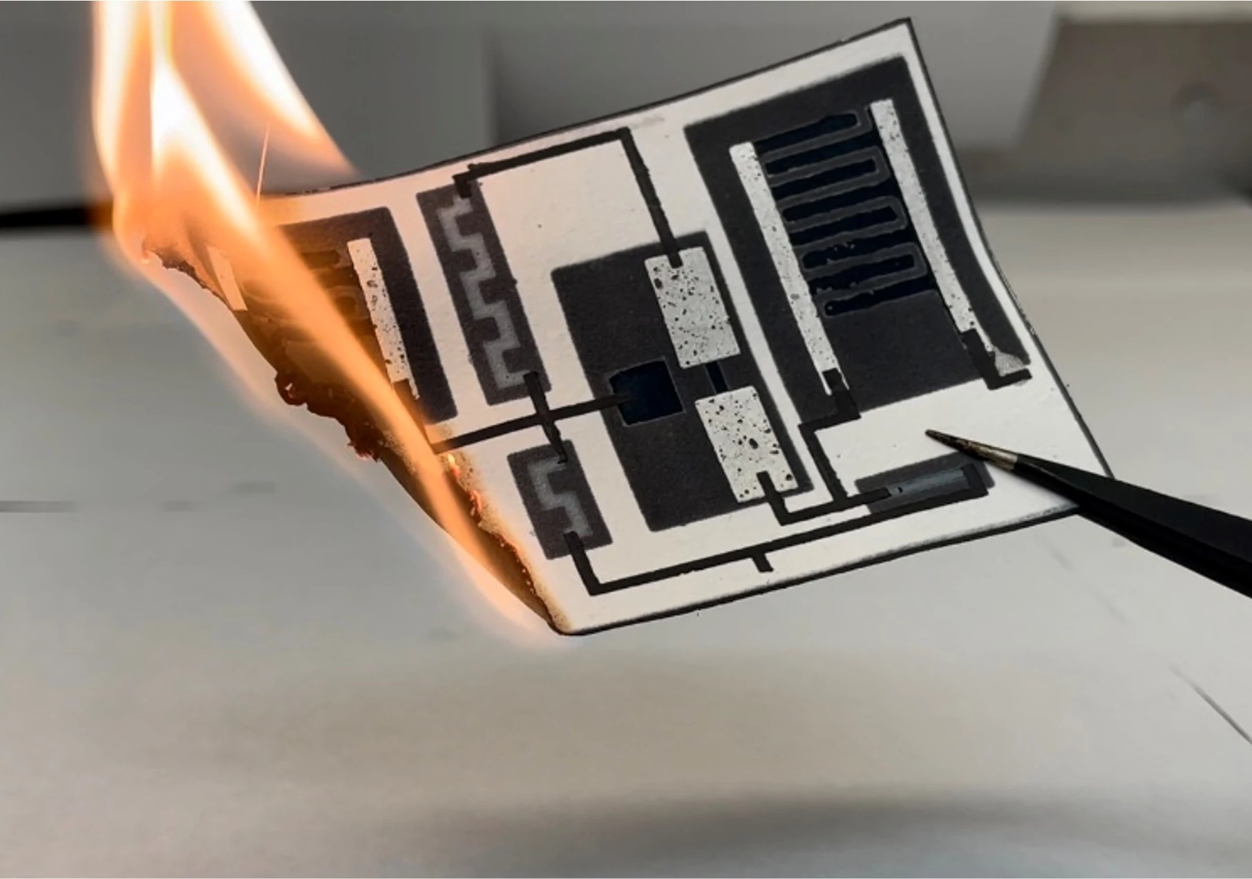 The paper circuit board is completely rendered to ash when burned – not an entirely "green" method of disposal, but perhaps better than leaving its components to leach into the environment