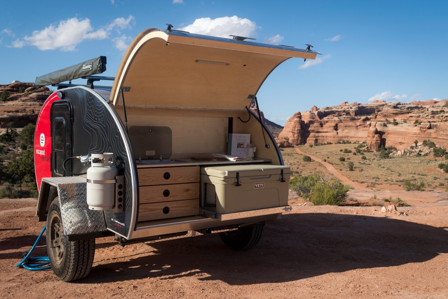 The galley does not come standard with a built-in stove (one is available optionally, as shown) but does include the Yeti cooler
