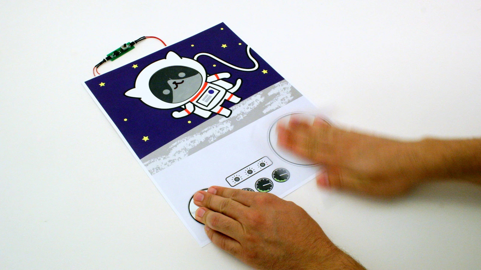 A Paper Generator is used to reveal an astronaut cat's e-ink face