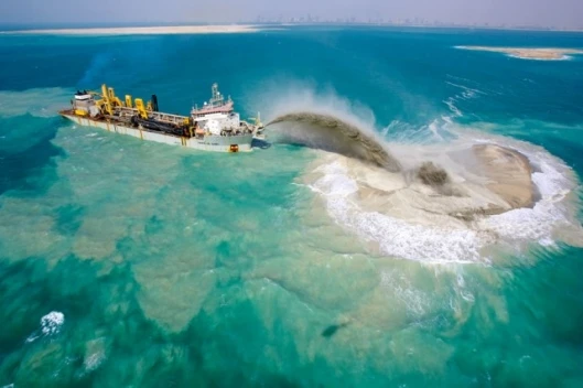 Nakheel's island building methodology involves spraying a mixture of sand and water into place, and after adding hundreds of kilometres to Dubai's coastline, they have it down to a fine art
