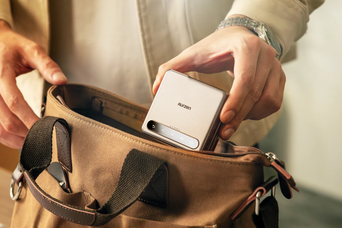 The world's first tri-fold portable pico projector collapses down for between use transport