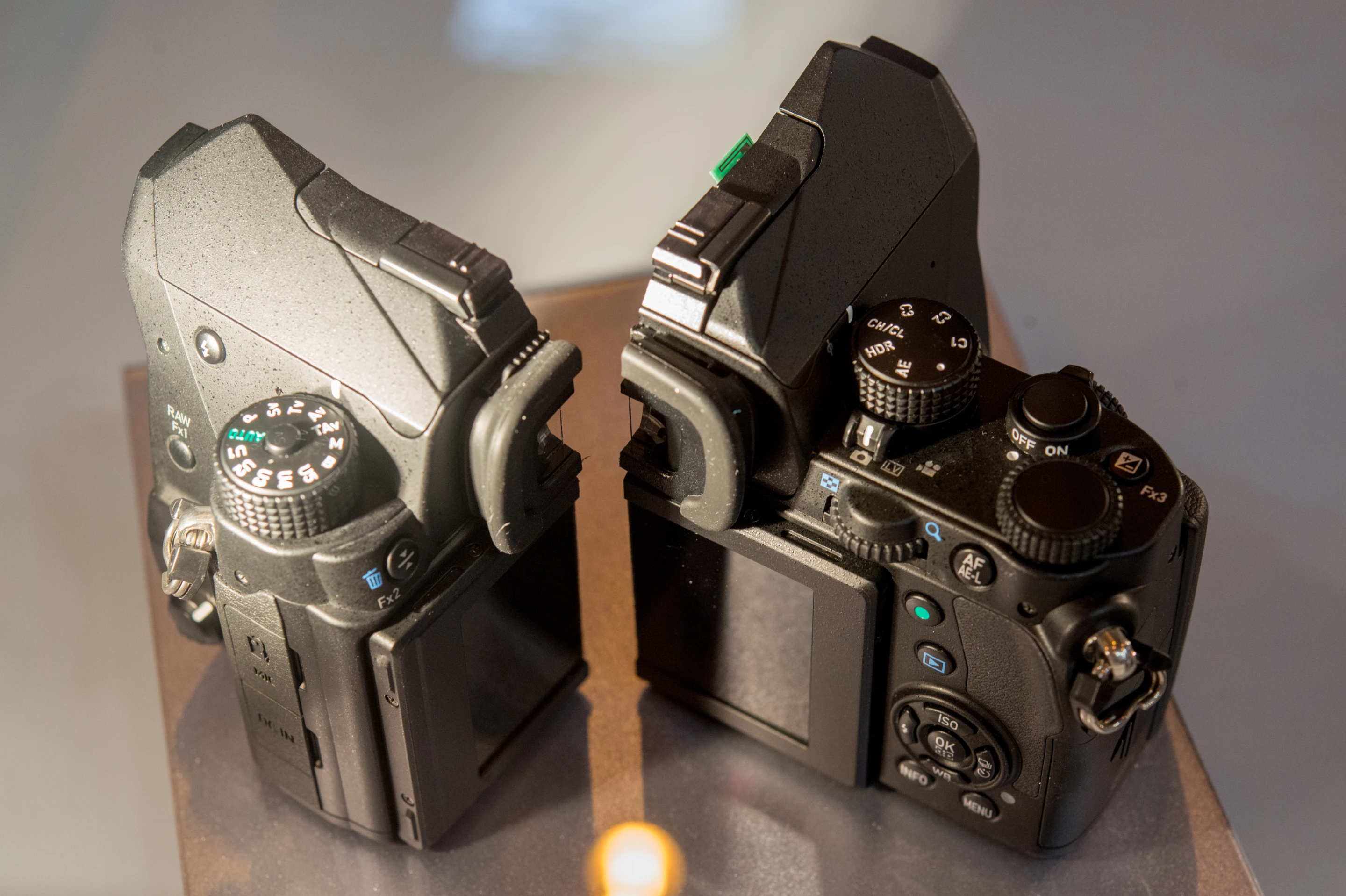 A Pentax KP DSLR on display at The Photography Show sliced in half