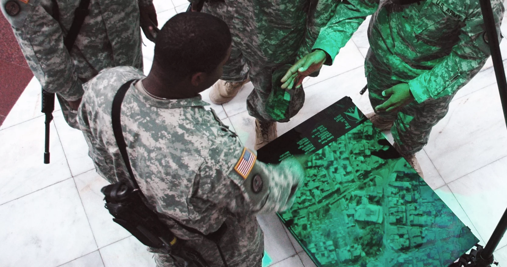 U.S. Soldiers prepare for a mission using Zebra Imaging's holograms as 3D maps (Image: Zebra Imaging & U.S. Army)