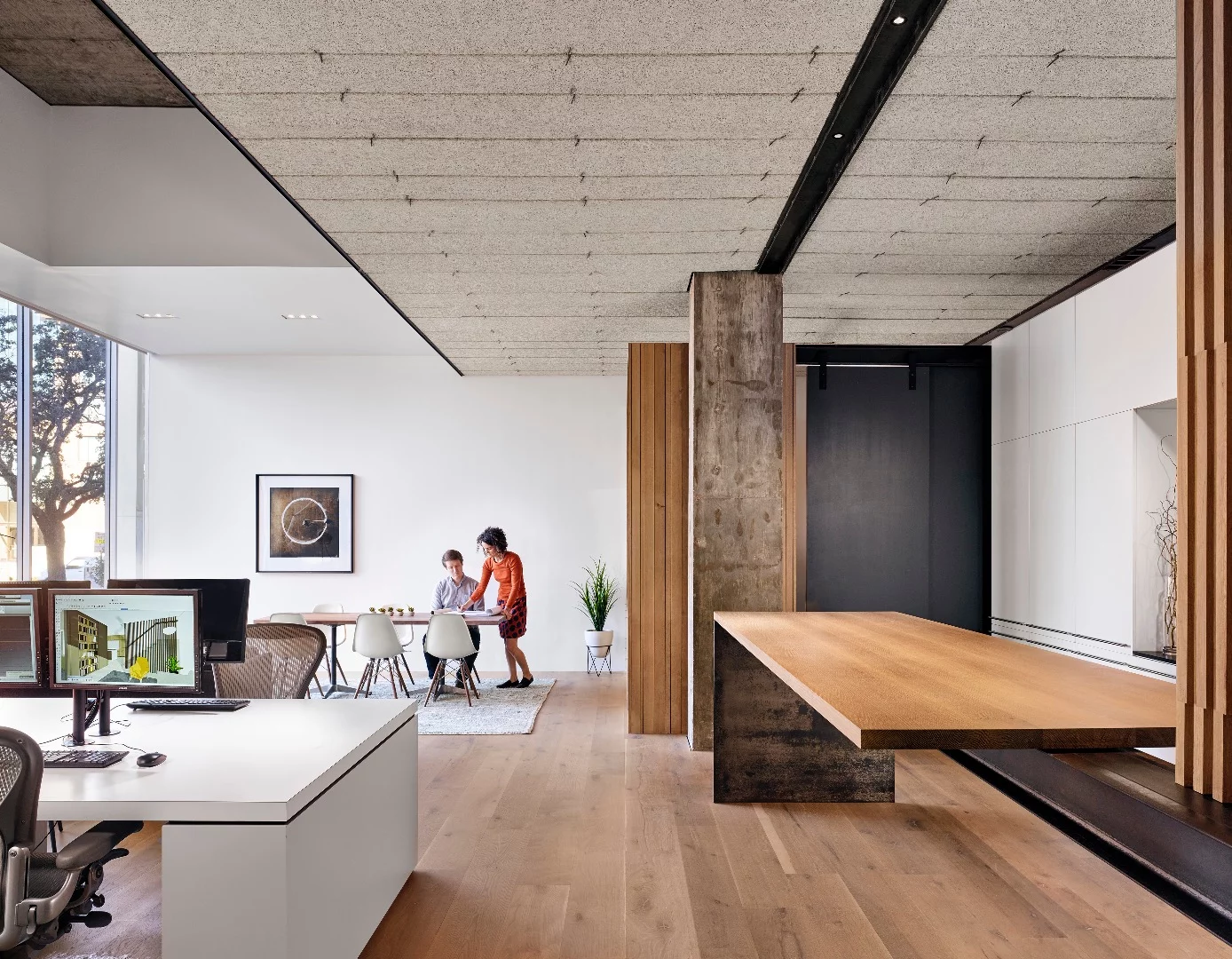 Alterstudio Architecture installed sound-absorbing ceiling panels, composed of aspen wood fibers, to cover an array of valves and mechanical equipment