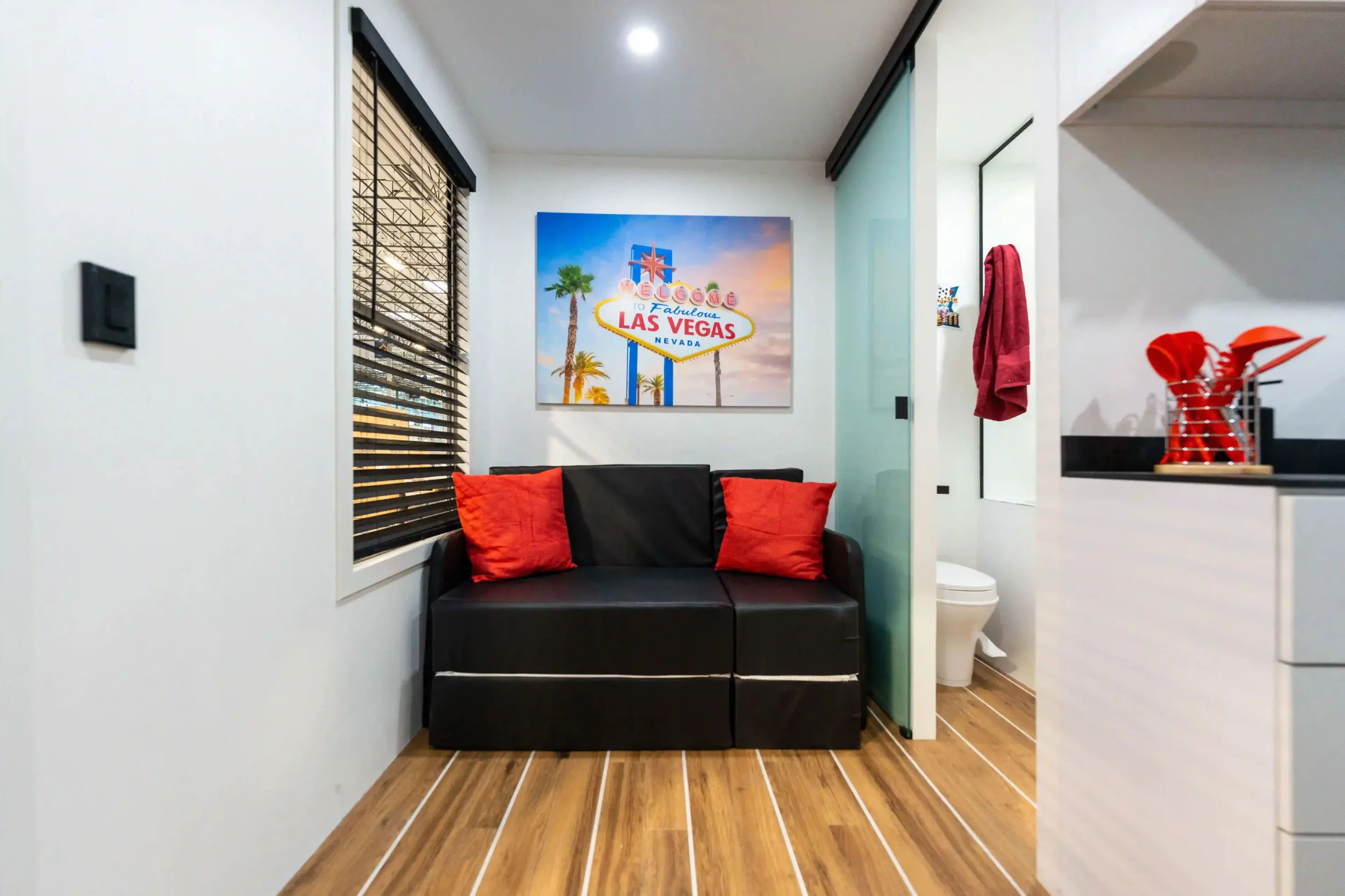 Inside the Baby Box livingroom/bedroom with its custom SLS (sit, lounge, sleep) couch