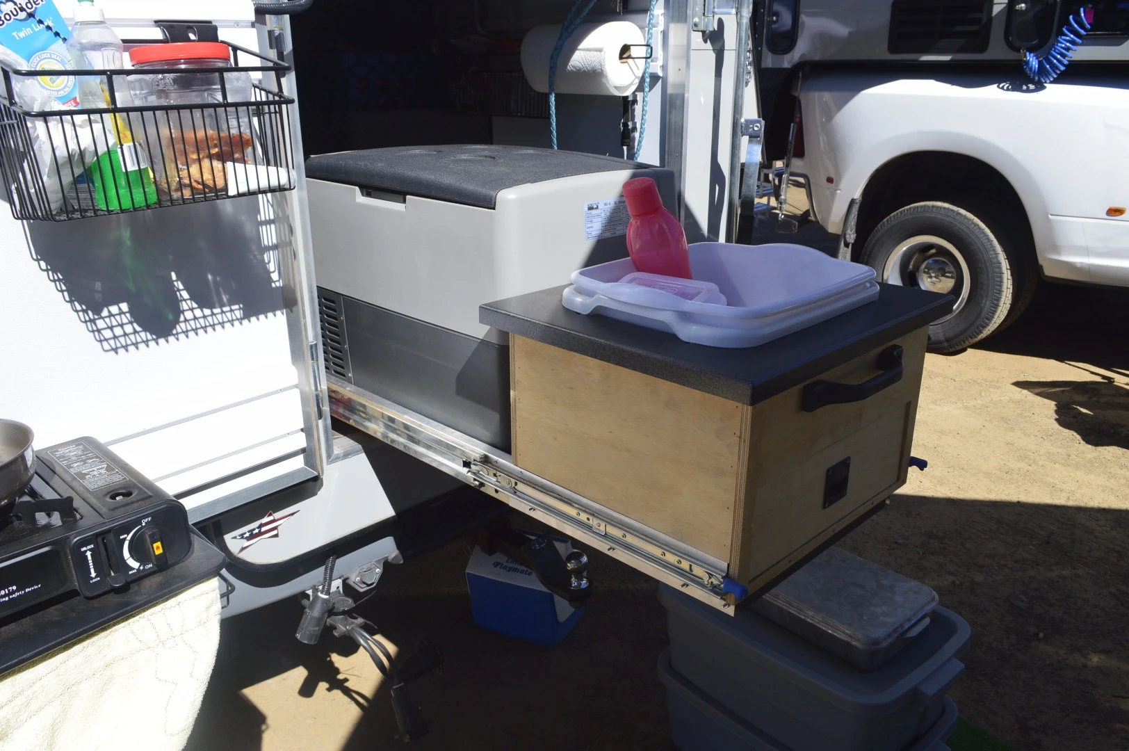The pull-out and VersaTrack system on the cargo door combine for a compact but functional kitchen space