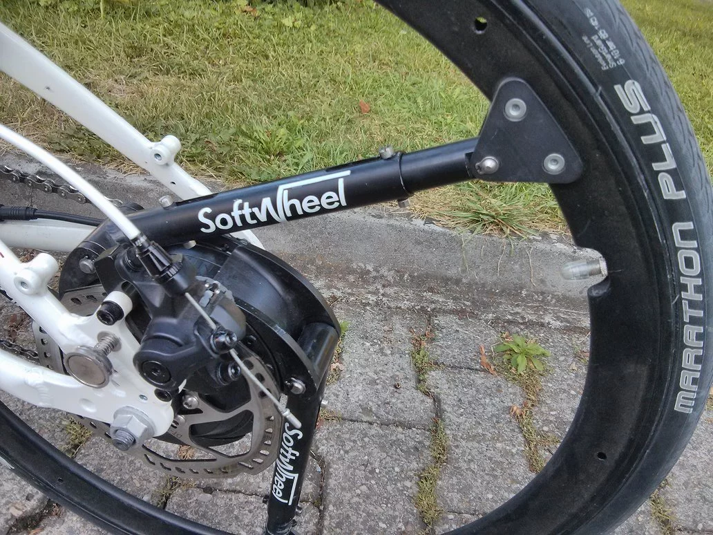 The shocks remain rigid when going over smooth surfaces, but compress when the wheel takes particularly big hits