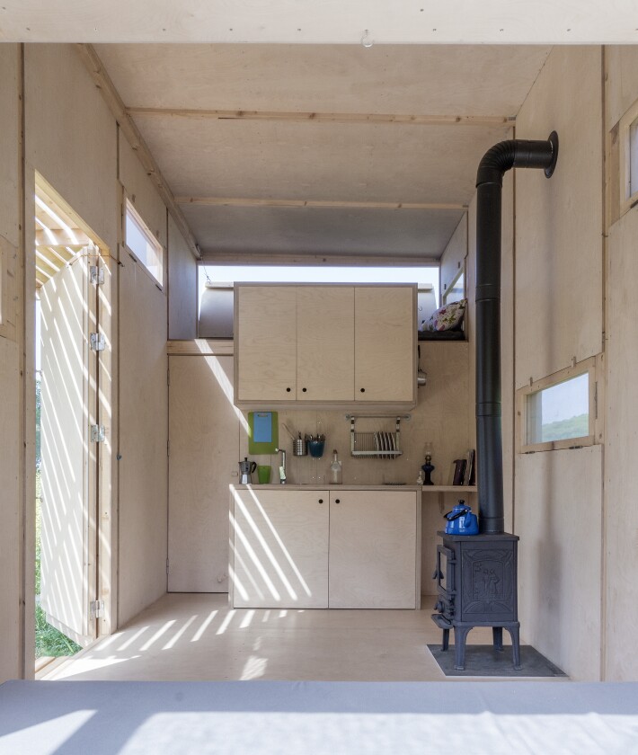 The Cabin on the Border is heated with a wood-burning stove
