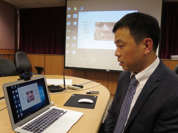 Professor Cheung Yiu-ming demonstrates his team's novel new lip reading password authentication system