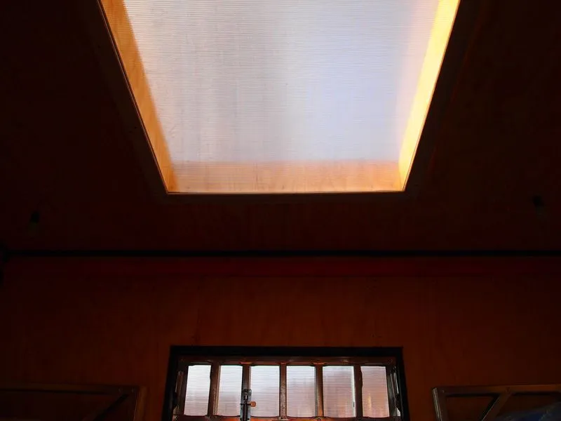 A large central skylight eliminates the need for lighting during the day