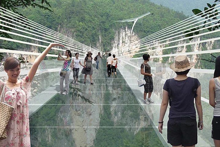 An artist's concept of people walking across the glass bridge high above the Zhangjiajie canyon in China