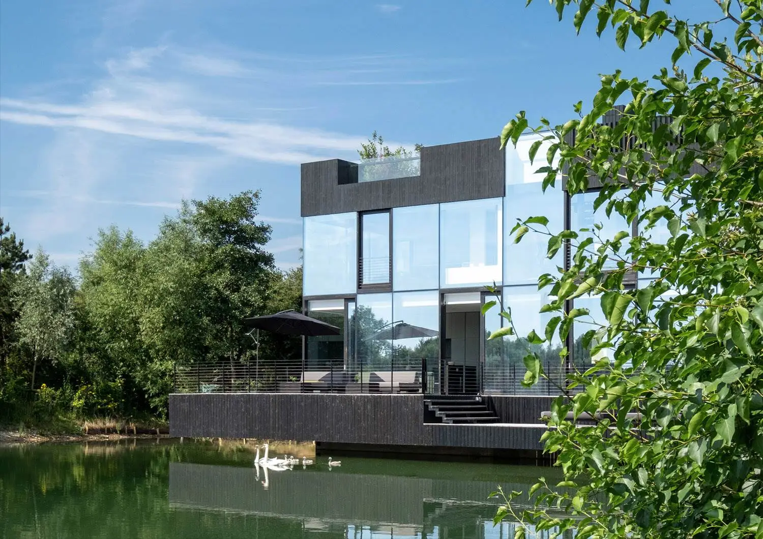 Glass Villa on the lake is a stunning home on the water in Lechlade, UK