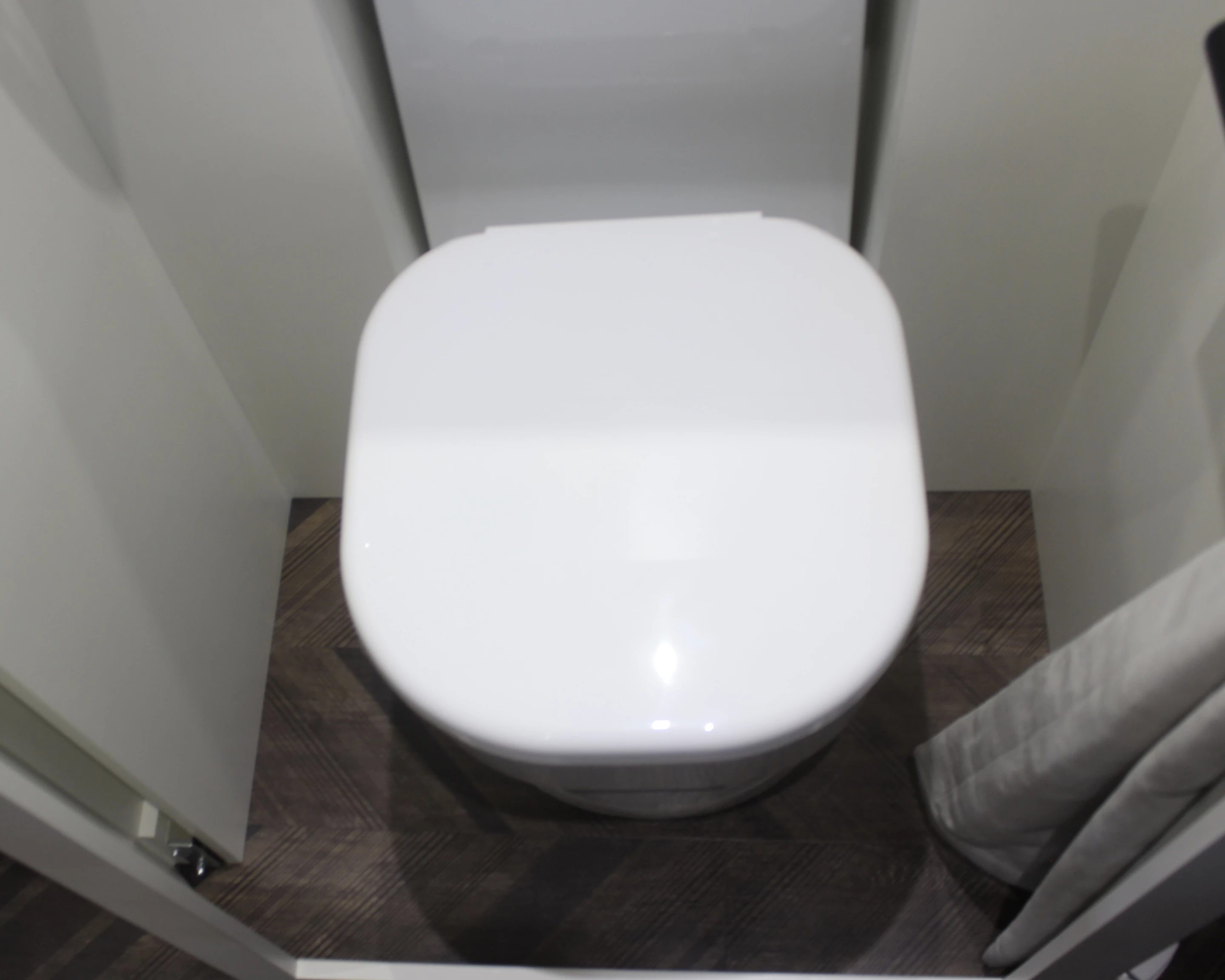 We don't see a drain on the floor, so it seems the Lounge's bathroom is just a toilet room, not a wet bath with shower