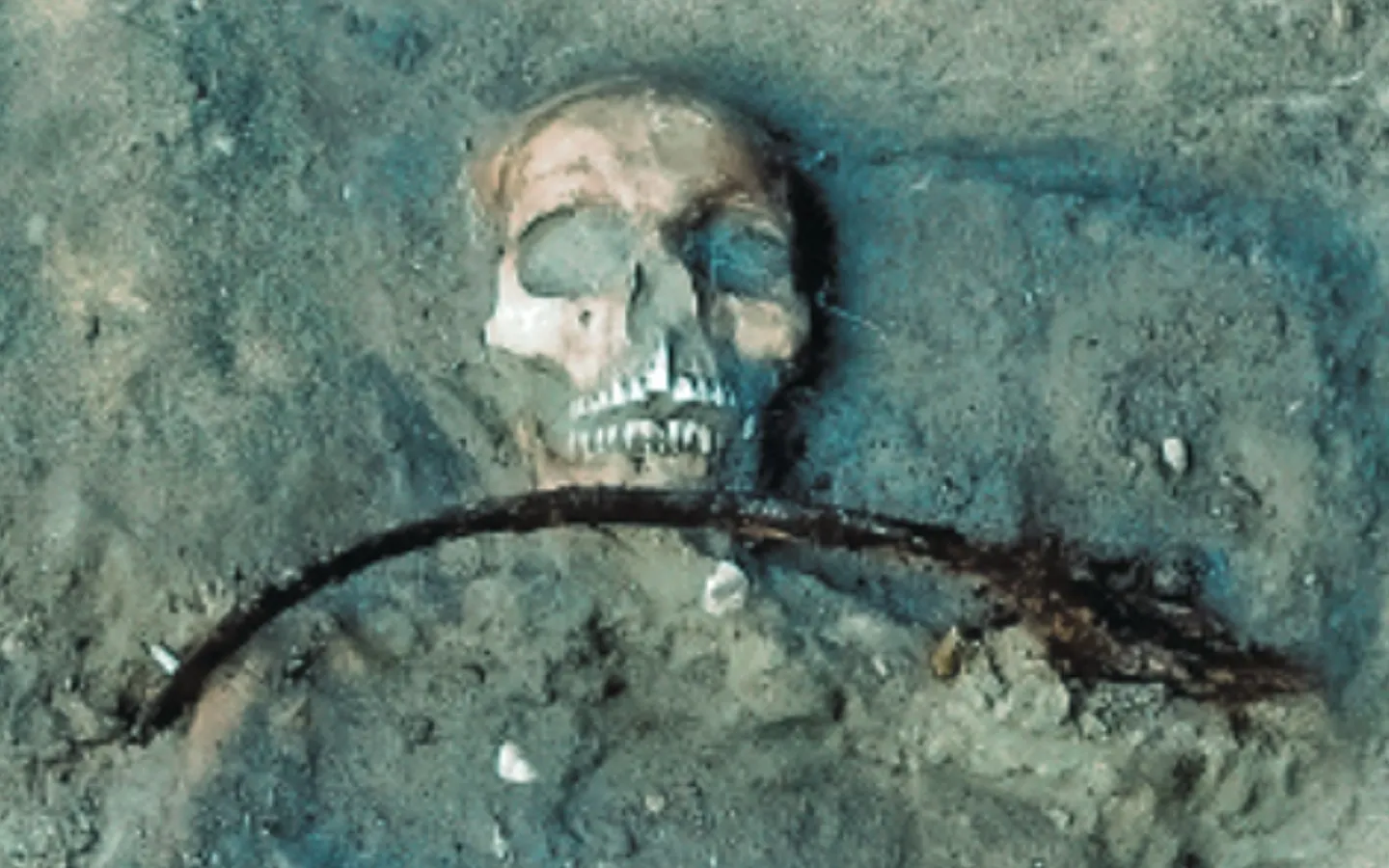 Polish burial reveals a young woman guarded by a sickle and padlock
