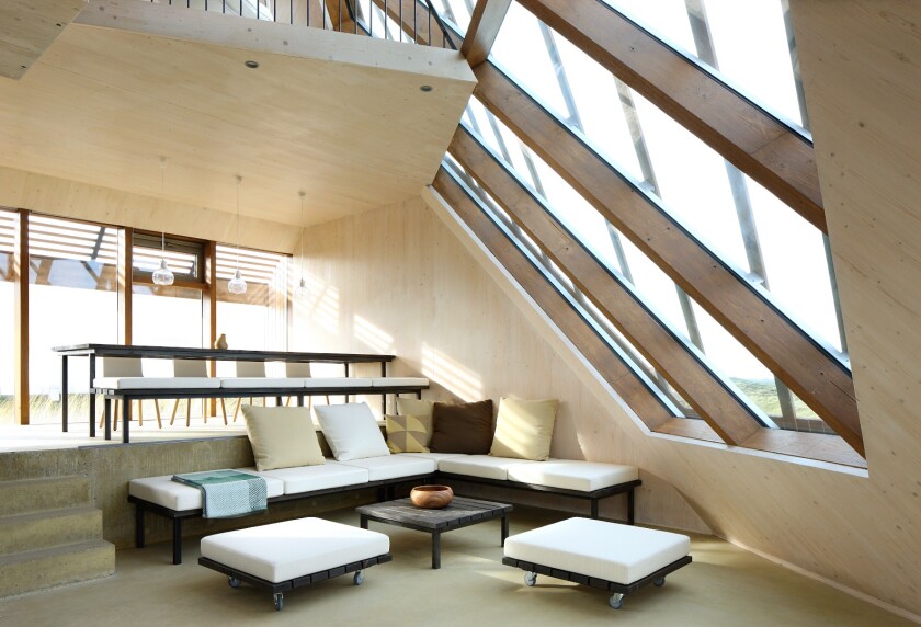 The lounge areas are separated by staggered half-floors, accessed by stairs (Photo: Filip Dujardin)