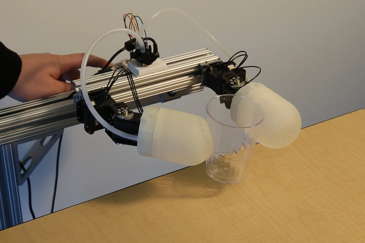 Disney's inflatable grasping modules pick up a plastic cup without crushing it