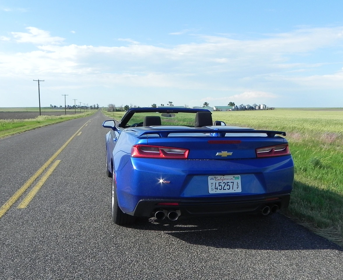 The heavy rear end of the previous-generation Camaro is de-emphasized with the new Camaro's design