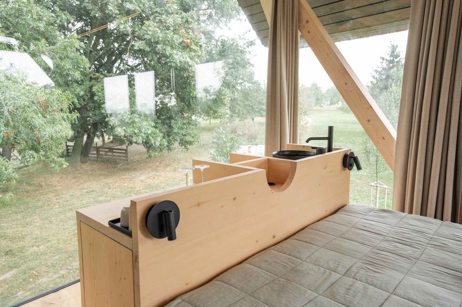 The bar unit is built into the back of the timber bed structure