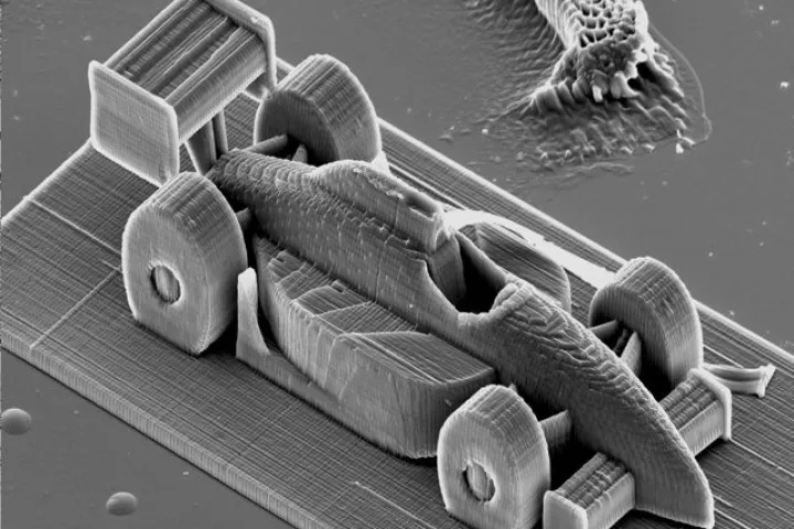 A race car model no larger than a grain of sand, created using the new high-speed two-photon lithography process
