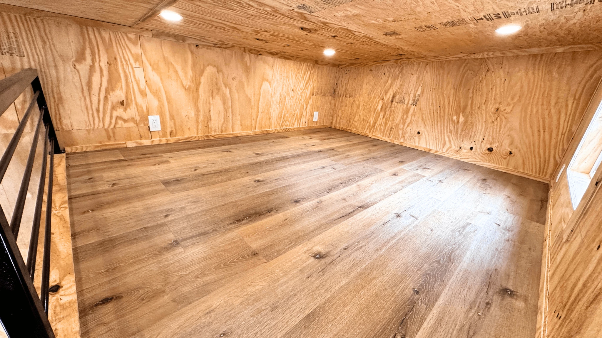 The Element features a typical tiny house-style loft bedroom with a low ceiling