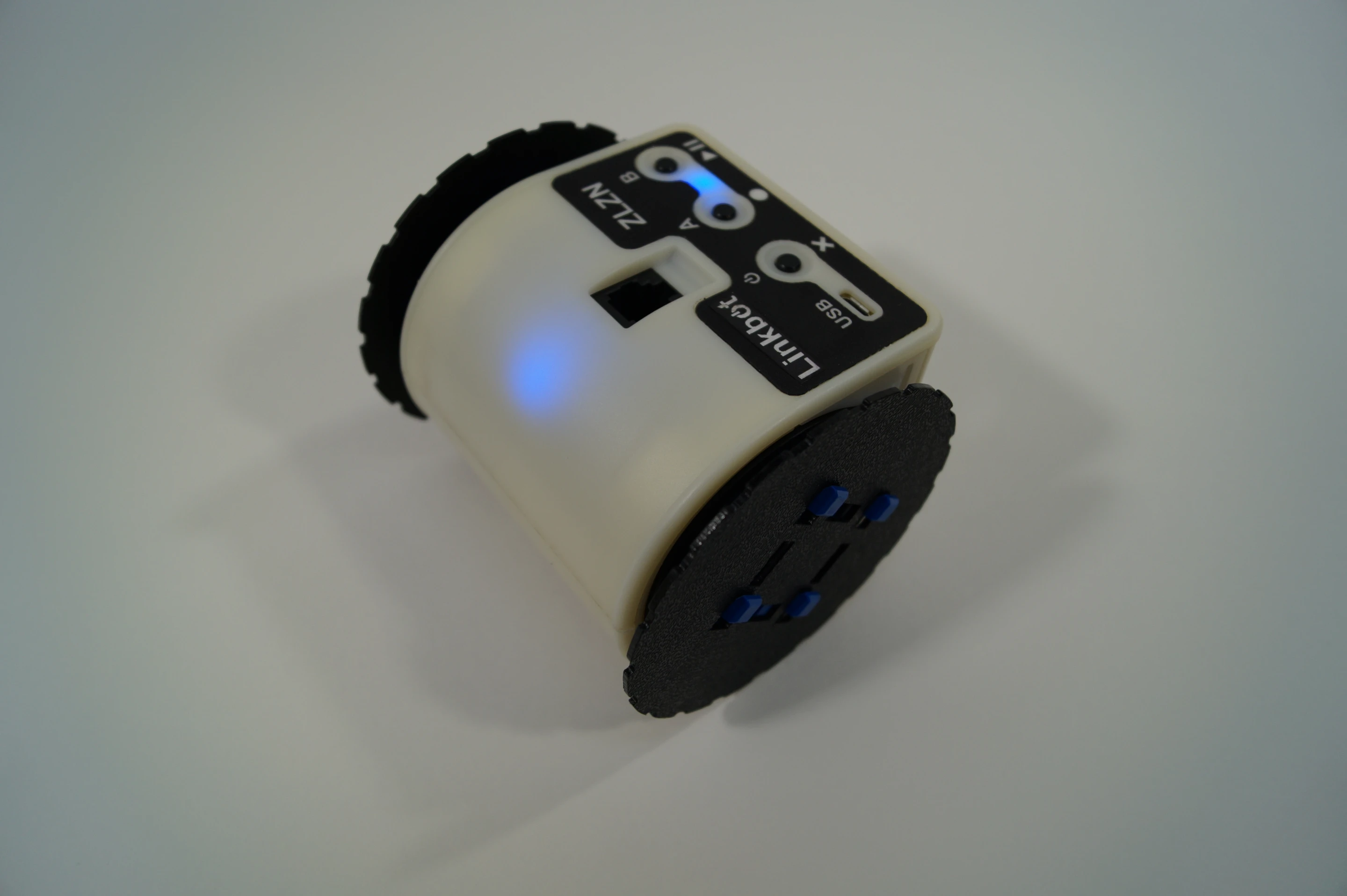 A single Linkbot is ready to roll, turn, crawl, stand, and tumble out of the box