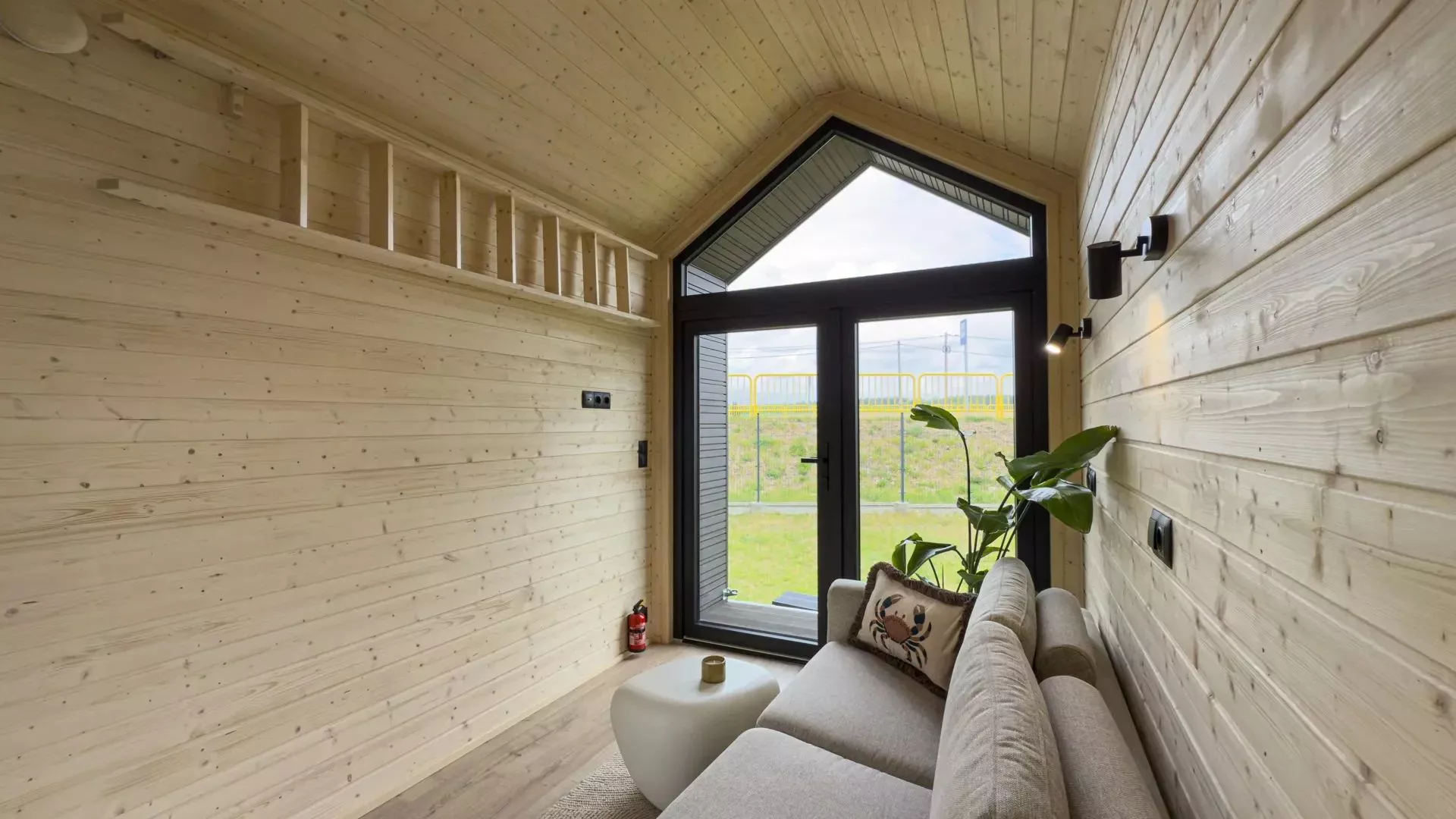 The large wall opposite the sofa hosts the loft ladder when not in use, but seems to be begging for a TV or projection screen