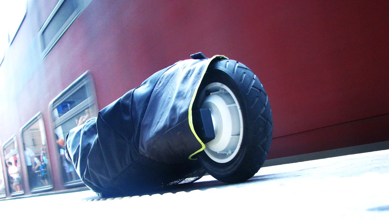 The MyWay Quick, folded and wrapped in its carry bag, can be wheeled alongside you