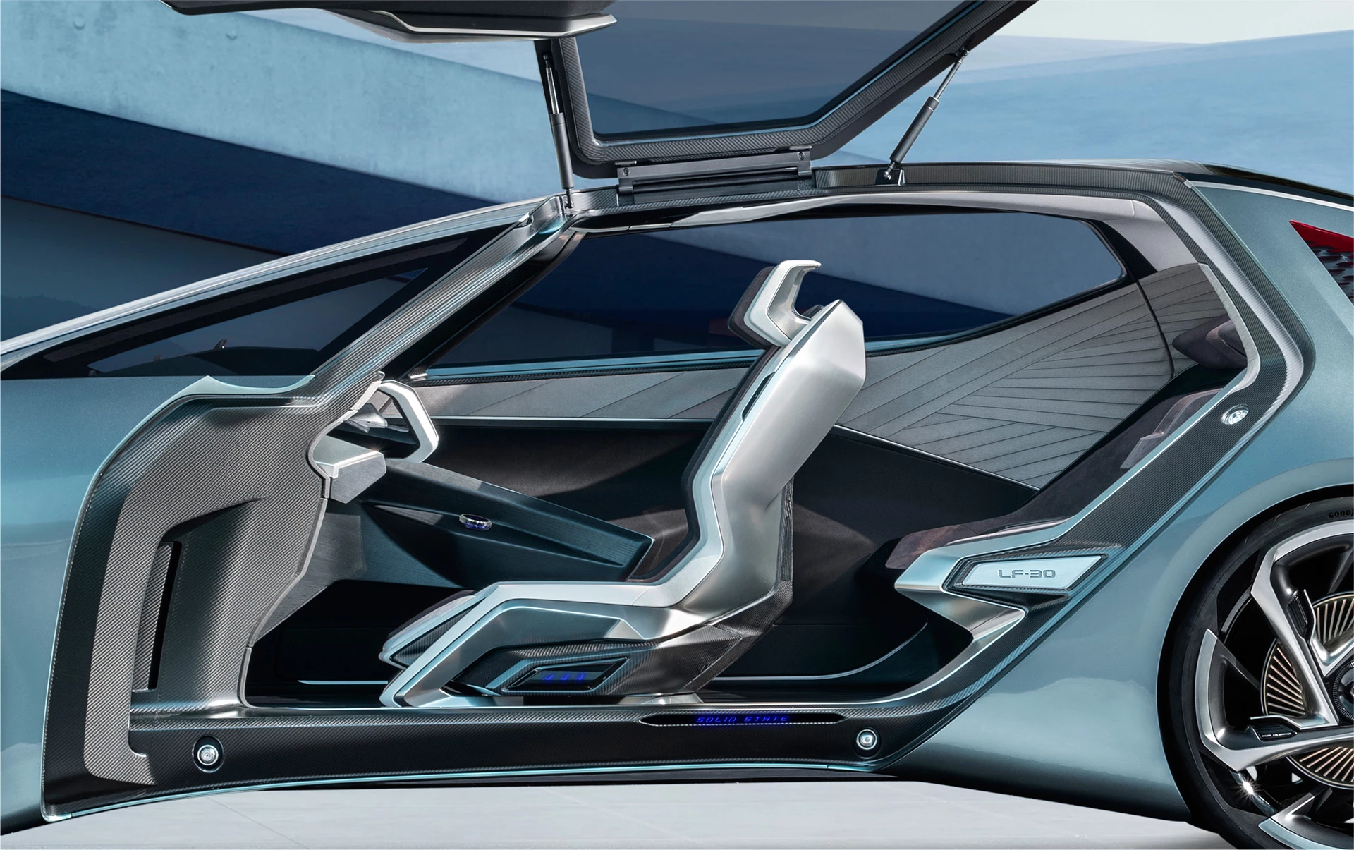 Lexus uses materials like charred cedar and recycled-metal fiber for the interior design