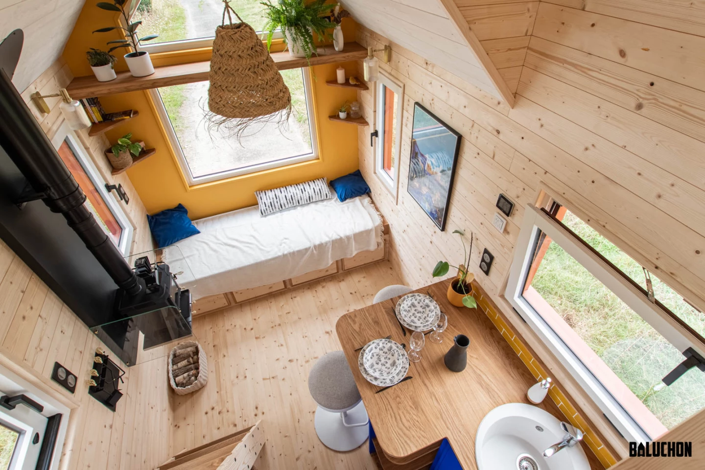 Leïla's tiny house features generous glazing, helping fill the interior with natural light