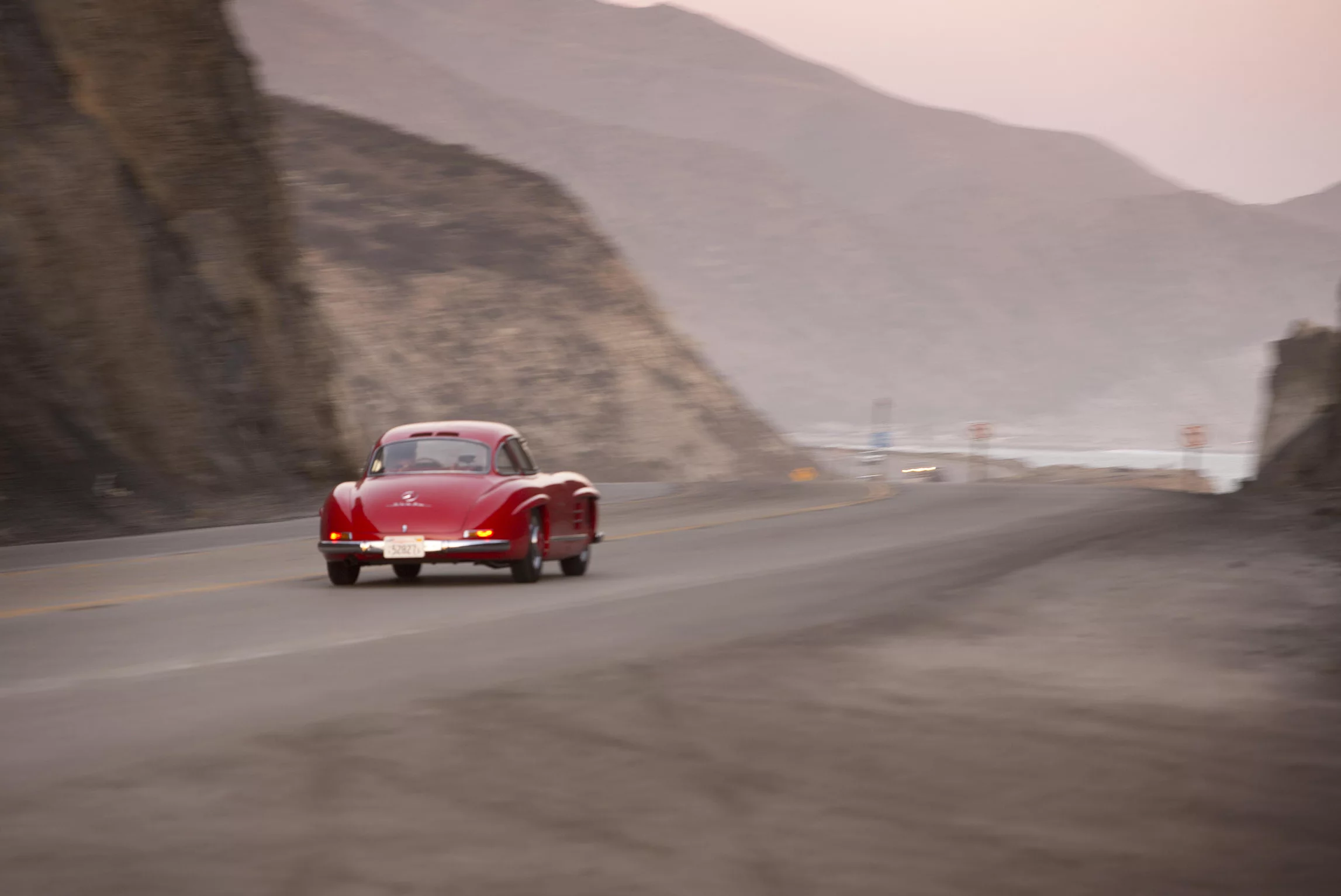 Instantly recognisable as the Mercedes-Benz 300SL (for Sports Leicht) Gullwing coupe, this 1955 model was built with DB 534 Feuerwehrrot (Fire Brigade Red) paintwork for its first owner, The Right Honourable Lord Terence O'Neill, Baron O'Neill of the Maine. At the end of 1945, Lord O'Neill and his family went to live in Northern Ireland, where he served in a series of political positions. Around the time he acquired the Gullwing, O'Neill was elevated to cabinet level, until his appointment as Prime Minister of Northern Ireland in 1963. Lord O'Neill remained in office until 1969. The entire history of the car and the model is detailed on the official auction page. The car was sold by Bonhams for US$1,375,000.