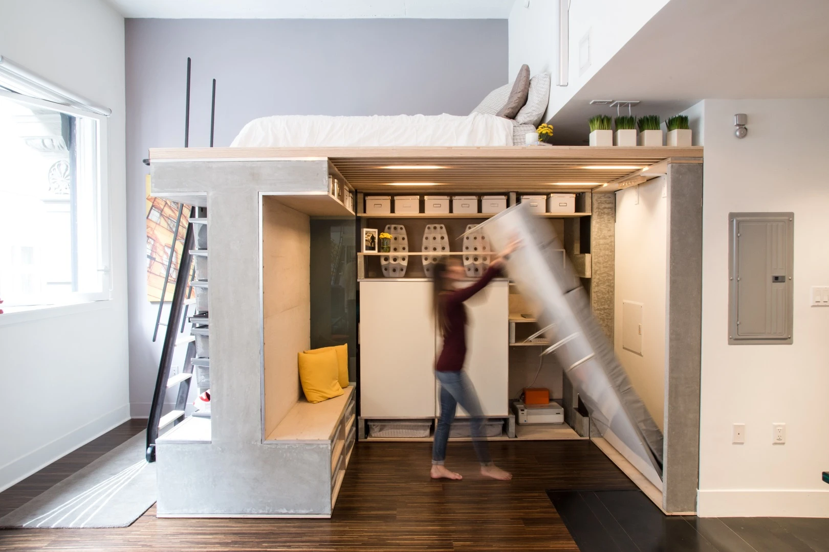 The dry-erase board wall folds down to provide a second bed