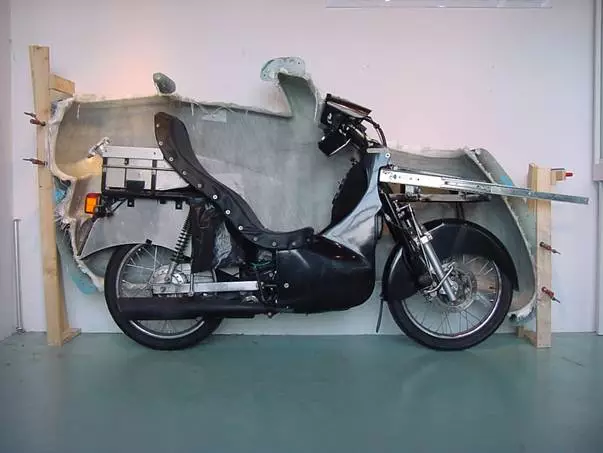 Sizing up the bike with its new cover