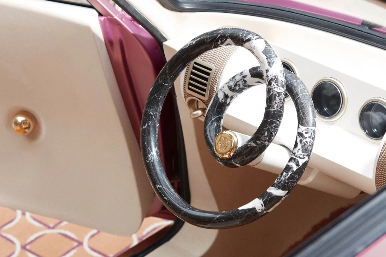 The Renault 5 Diamant's pretzel-like marble-on-carbon steering wheel