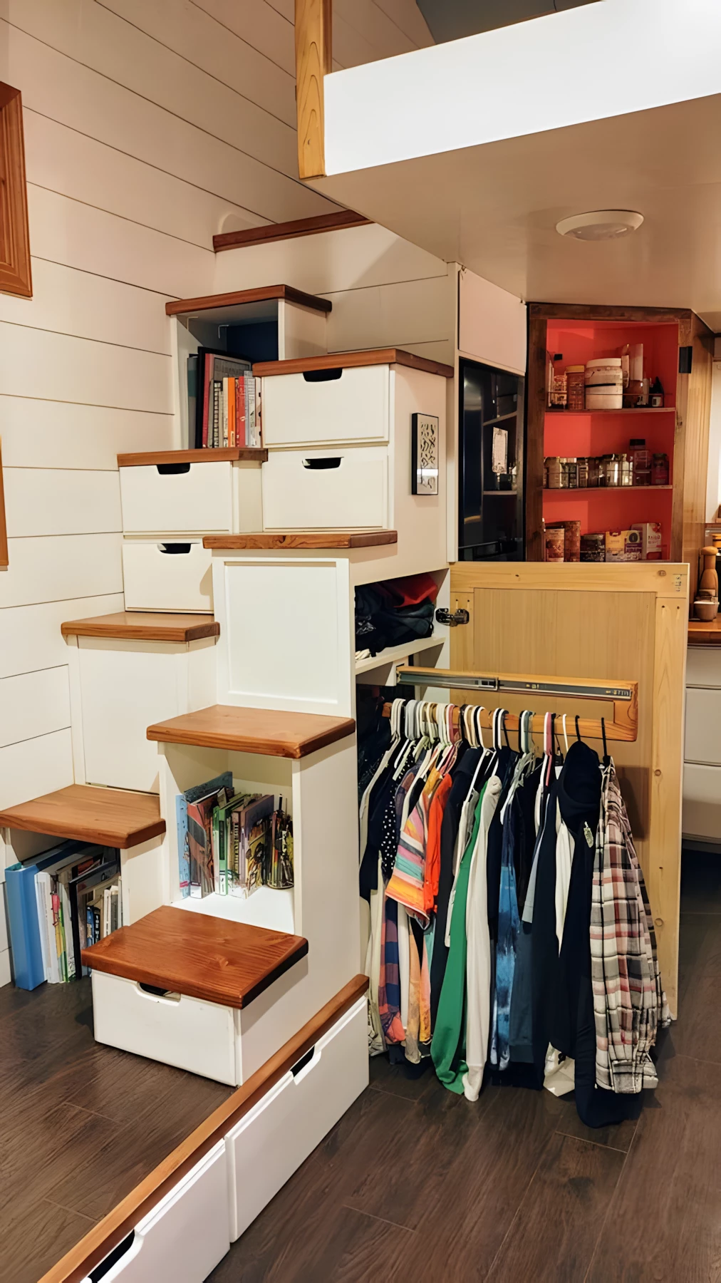 The Owl's Nest's main loft is reached by a space-saving alternating-tread storage-integrated staircase