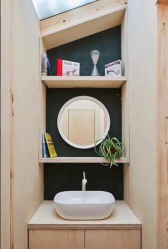 The garden studio even features a private toilet with basin