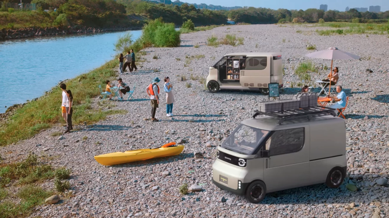 The Kayoibako-K finds both commercial (coffee/beverage vending) and recreational (kayak/gear shuttling) use at a river beach