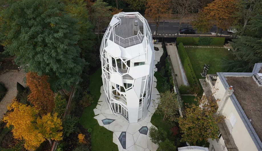 The Connected House, Boulogne-Billancourt, France by Jakob+Macfarlane, a winner in the "Private Homes" category at the 2018 International Architecture Awards. This structure is inspired by natural tree systems, which surround its green suburban home in Paris