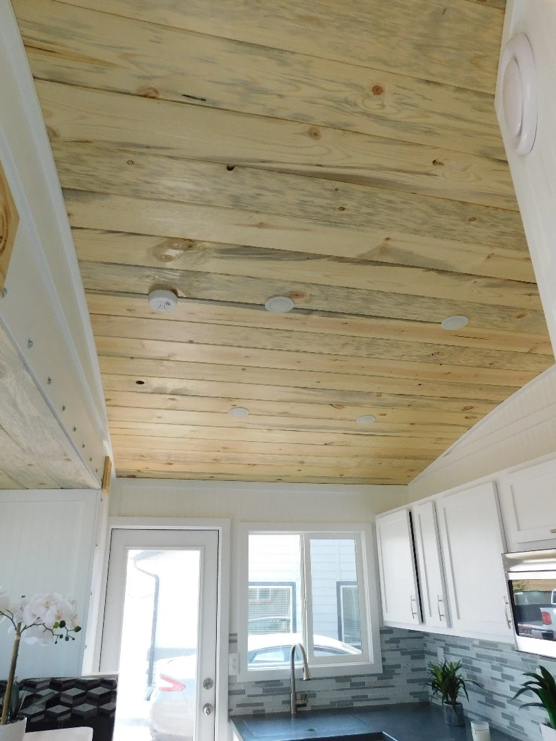 The Ozark's interior walls are finished in beadboard, with beetle kill pine ceiling and vinyl floor