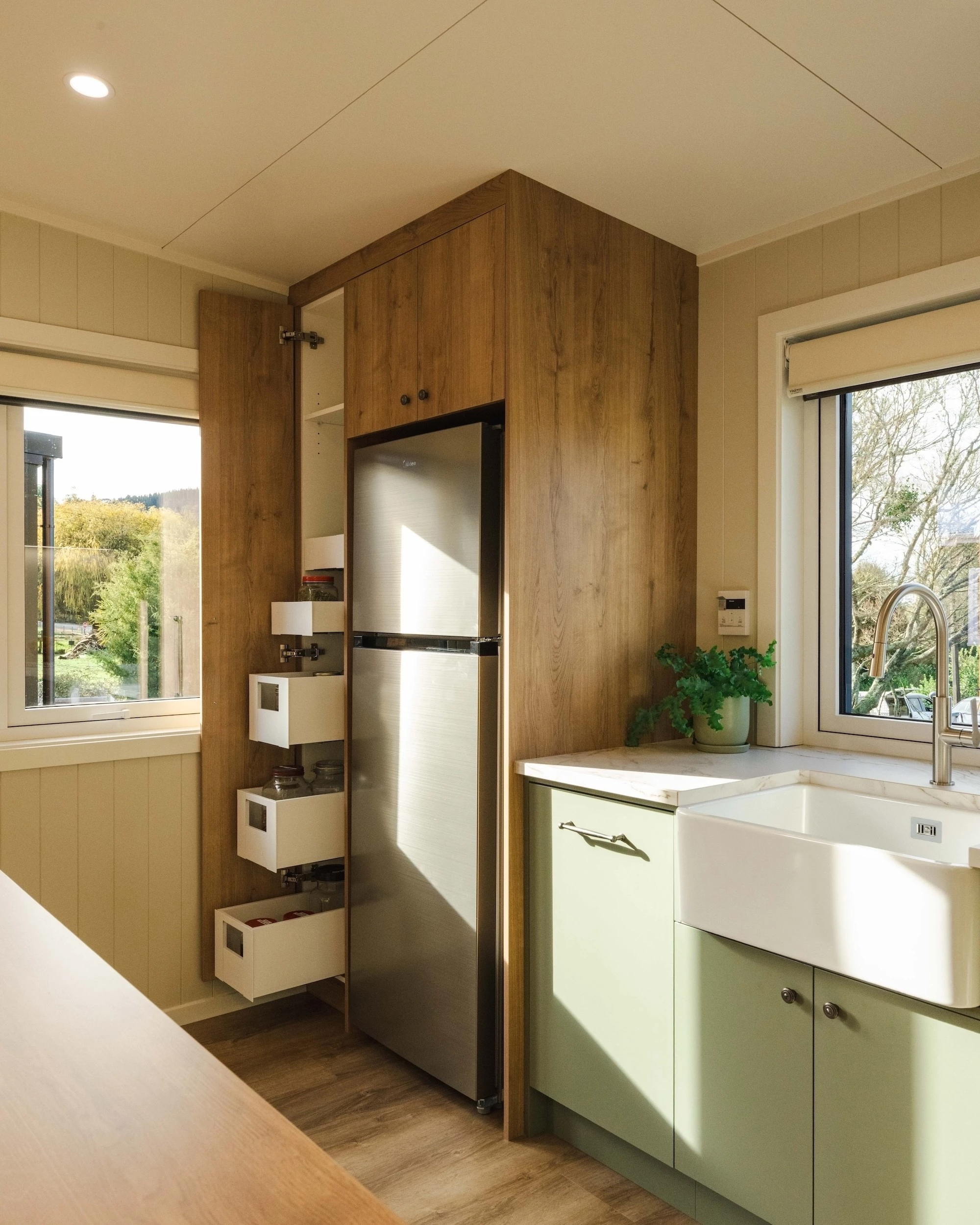The English Garden's kitchen has lots of storage space for a tiny house