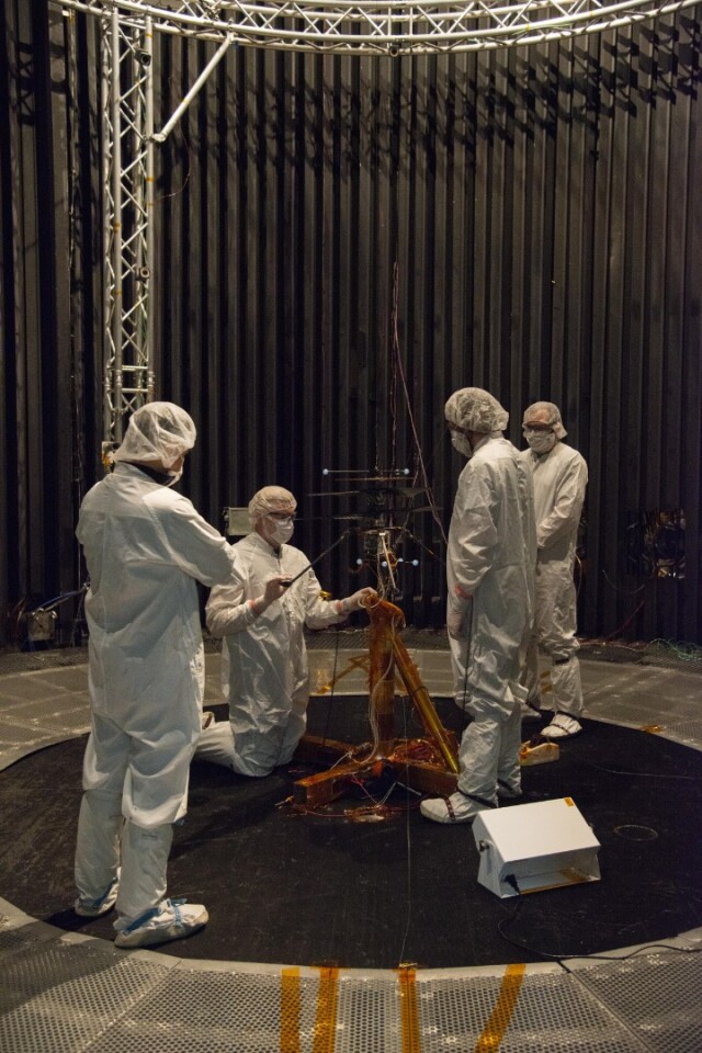 Members of NASA's Mars Helicopter team prepare the flight model